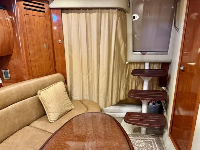 Slide: The Image of Interior of 2005 Sea Ray 360 Sundancer with wood finish and beige seating. - 46