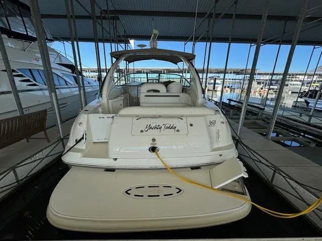 Slide: The Image of 2005 Sea Ray 360 Sundancer yacht docked in marina, rear view. - 5