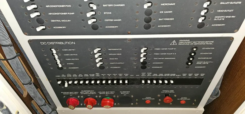 Slide: The Image of Electrical control panel of a 2002 Pursuit 3800 Express boat. - 25