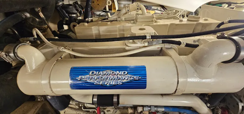 Slide: The Image of Engine compartment of a 2002 Pursuit 3800 Express with Diamond Performance Series label. - 28