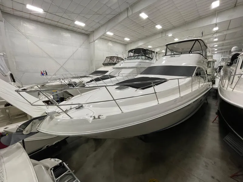 Slide: The Image of 2009 Sea Ray 580 Sedan Bridge yacht in indoor storage facility. - 21