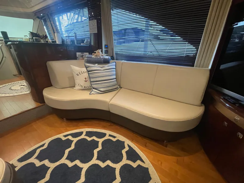 Slide: The Image of Luxurious interior of 2009 Sea Ray 580 Sedan Bridge with elegant seating and decor. - 30