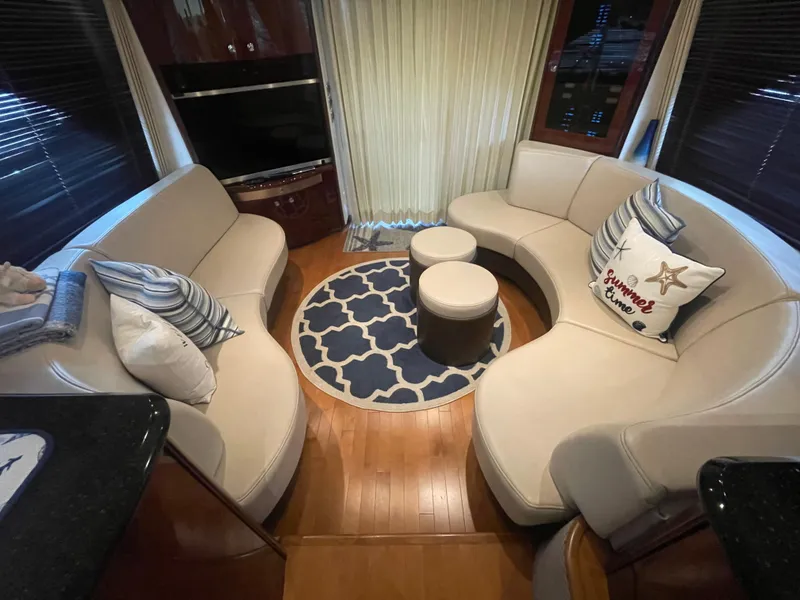 Slide: The Image of Luxurious interior of 2009 Sea Ray 580 Sedan Bridge with elegant seating and decor. - 31