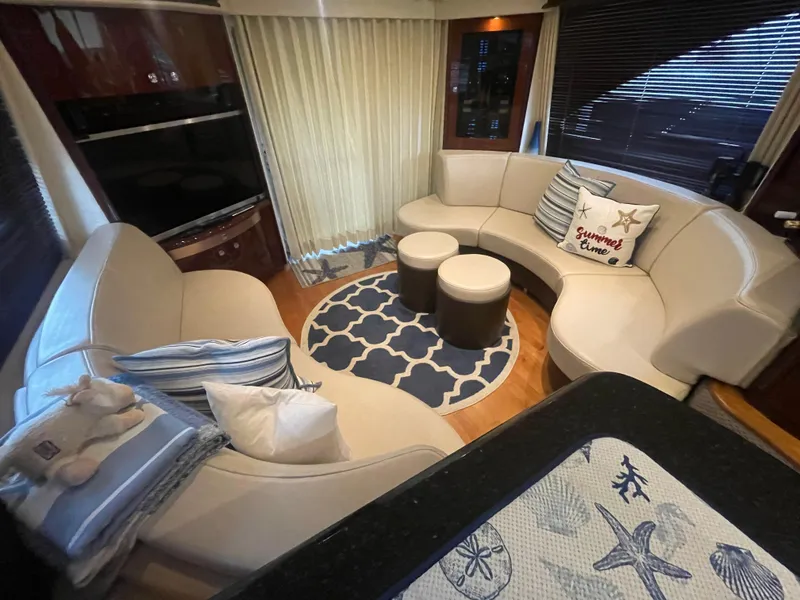 Slide: The Image of Luxurious interior of 2009 Sea Ray 580 Sedan Bridge yacht with elegant seating and decor. - 35