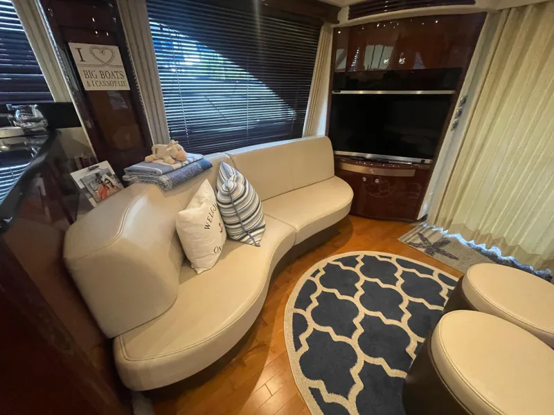Slide: The Image of Luxurious interior of 2009 Sea Ray 580 Sedan Bridge with curved sofa and modern decor. - 37