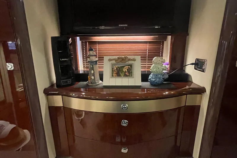 Slide: The Image of Luxurious interior of 2009 Sea Ray 580 Sedan Bridge with elegant decor and wooden cabinetry. - 47