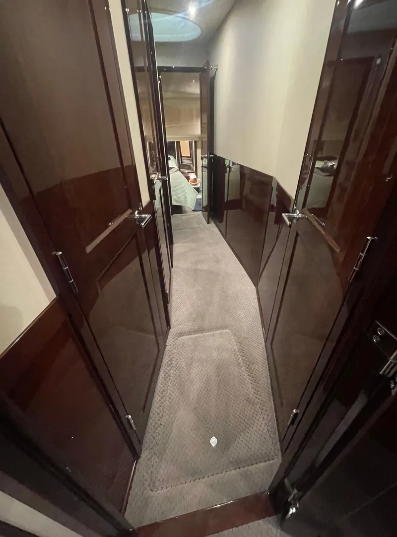 Slide: The Image of Interior hallway of 2009 Sea Ray 580 Sedan Bridge yacht with carpeted flooring. - 48