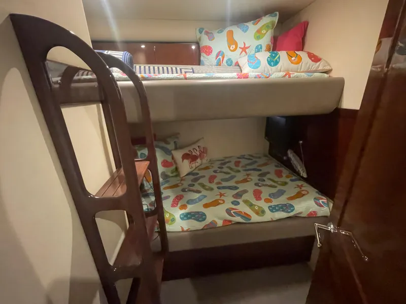 Slide: The Image of Bunk beds with colorful bedding in 2009 Sea Ray 580 Sedan Bridge cabin. - 49