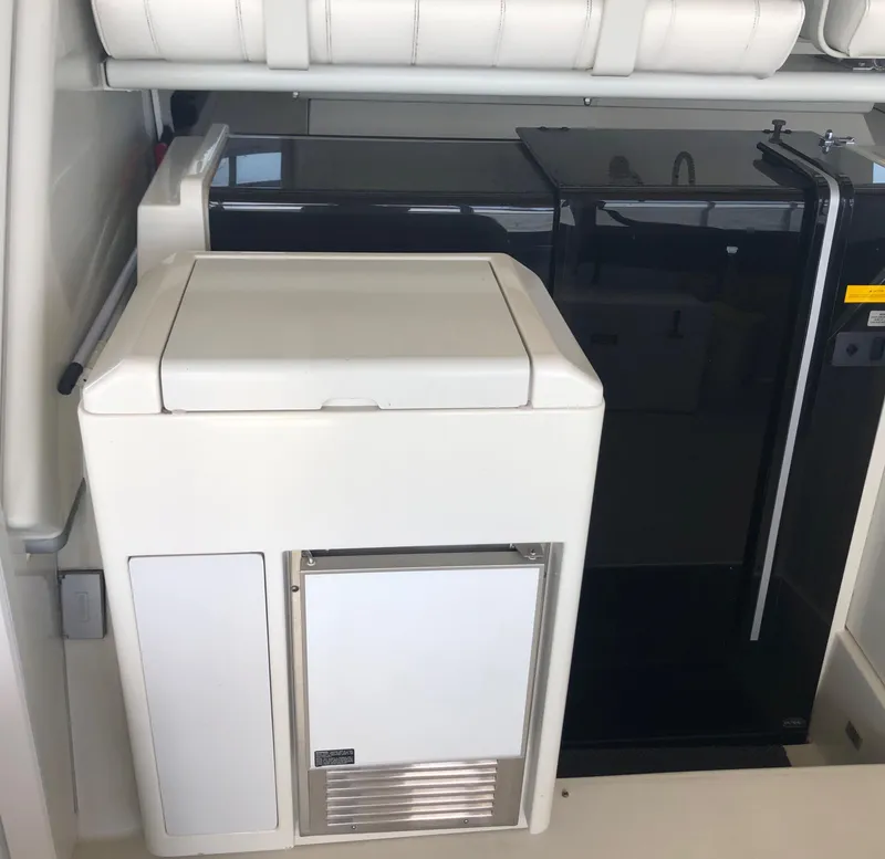 Slide: The Image of 1996 Carver 355 Aft Cabin interior with modern appliances and sleek design. - 20