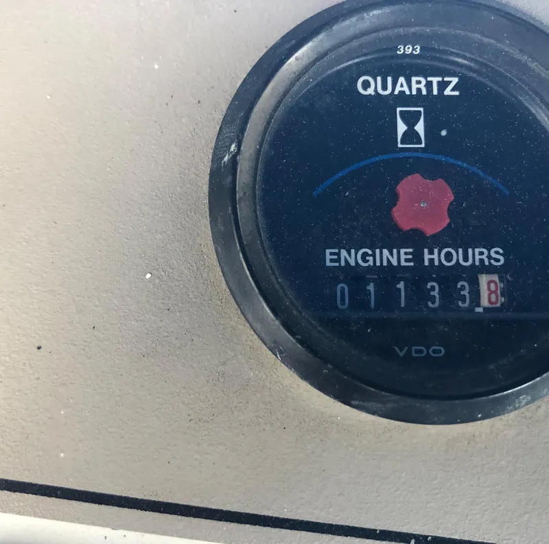 Slide: The Image of 1996 Carver 355 Aft Cabin engine hour meter showing 1133.8 hours. - 31