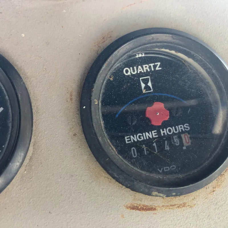 Slide: The Image of 1996 Carver 355 Aft Cabin engine hour meter showing 1,450 hours. - 32