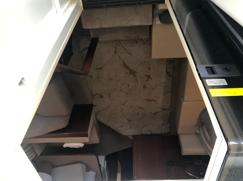 Slide: The Image of 1996 Carver 355 Aft Cabin interior with patterned upholstery and seating area. - 33