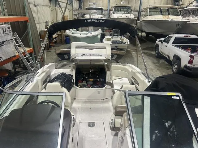 Slide: The Image of 2017 Chaparral 246 SSi boat in storage, interior view with open engine compartment. - 10