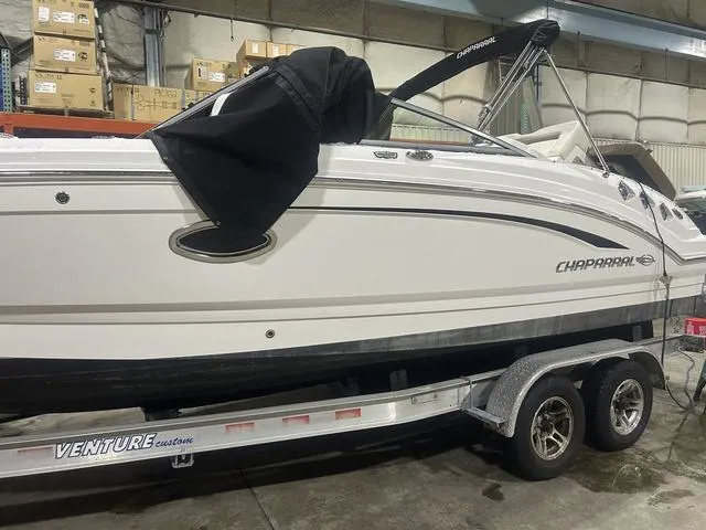Slide: The Image of 2017 Chaparral 246 SSi boat on a Venture trailer in a storage facility. - 3