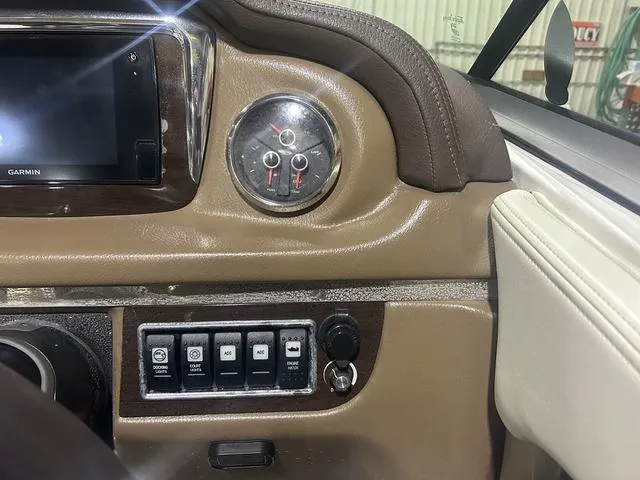 Slide: The Image of Dashboard of a 2017 Chaparral 246 SSi boat with Garmin display and control switches. - 6