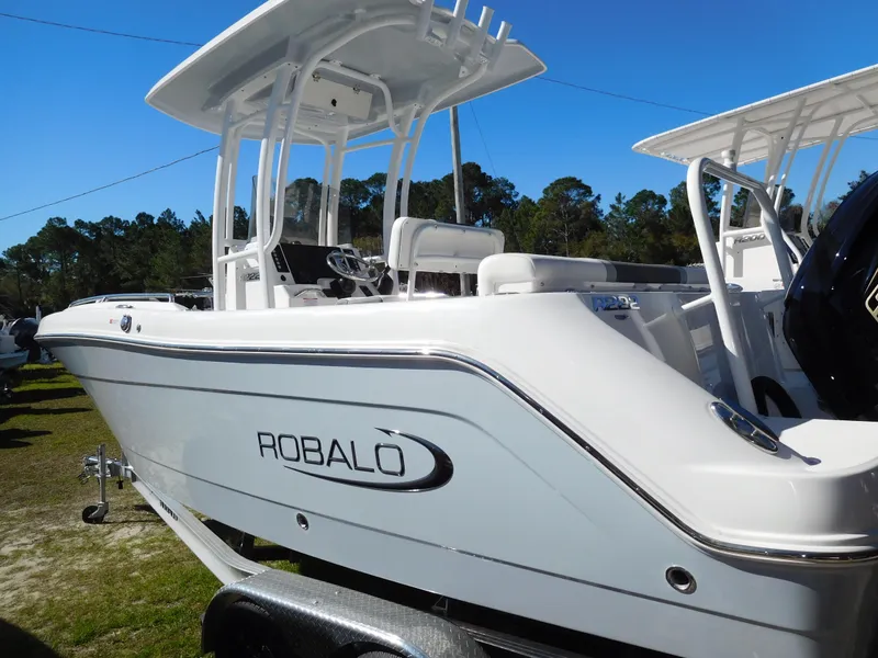 The Image of 2025 Robalo R222 Center Console boat displayed outdoors. - 1