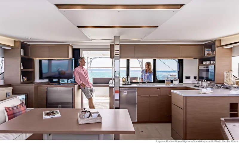 Slide: The Image of Modern interior of 2025 Lagoon 46 ICONIC yacht with spacious kitchen and ocean view. - 10