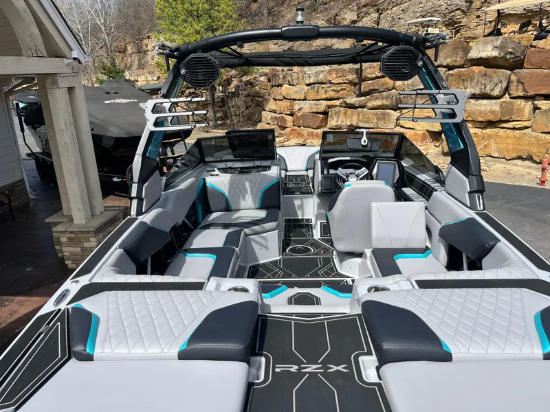 Slide: The Image of 2023 Tigé 22RZX boat interior with modern seating and sleek design. - 13