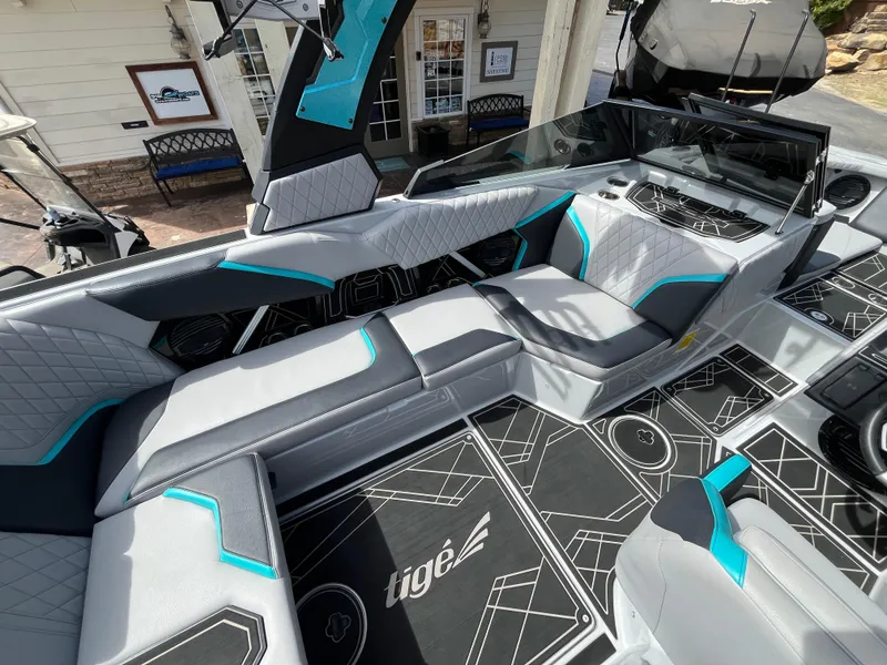 Slide: The Image of 2023 Tigé 22RZX boat interior with modern seating and stylish design elements. - 17