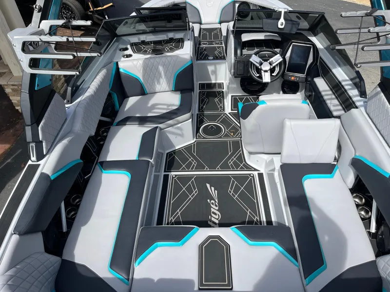 Slide: The Image of 2023 Tigé 22RZX boat interior with modern design, featuring sleek seating and advanced dashboard controls. - 18
