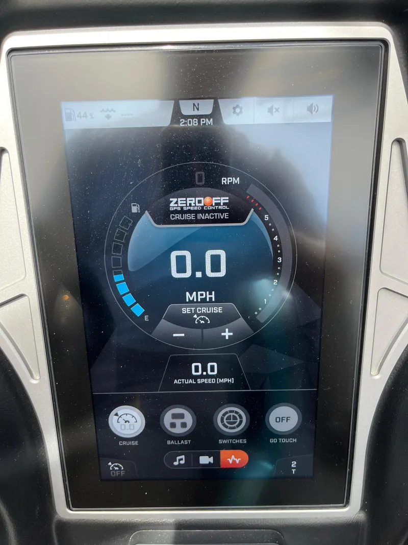 Slide: The Image of 2023 Tigé 22RZX boat dashboard display showing speed and cruise control settings. - 22