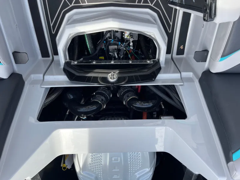 Slide: The Image of 2023 Tigé 22RZX boat engine compartment with visible components and sleek design. - 27