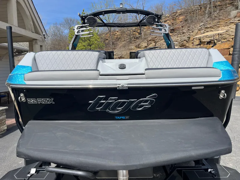 Slide: The Image of 2023 Tigé 22RZX boat with sleek black design and comfortable seating. - 5