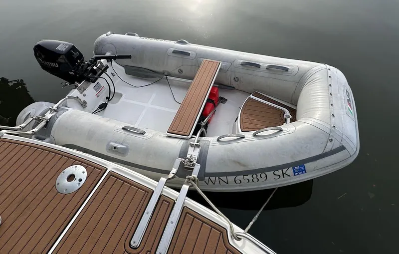 Slide: The Image of Inflatable boat docked beside a 2004 Sea Ray 340 Sundancer yacht. - 16