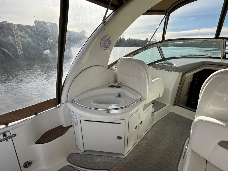 Slide: The Image of Interior of 2004 Sea Ray 340 Sundancer boat with sink and seating area. - 25