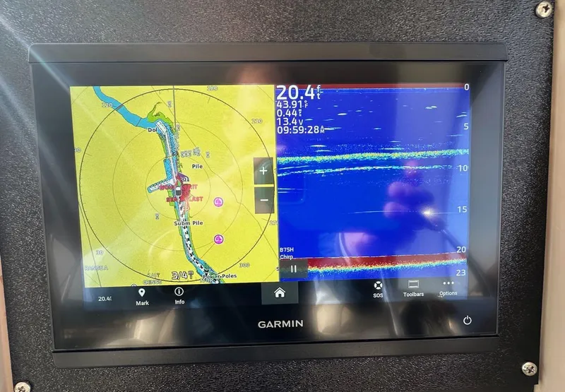 Slide: The Image of Garmin navigation display on 2004 Sea Ray 340 Sundancer, showing map and sonar data. - 33