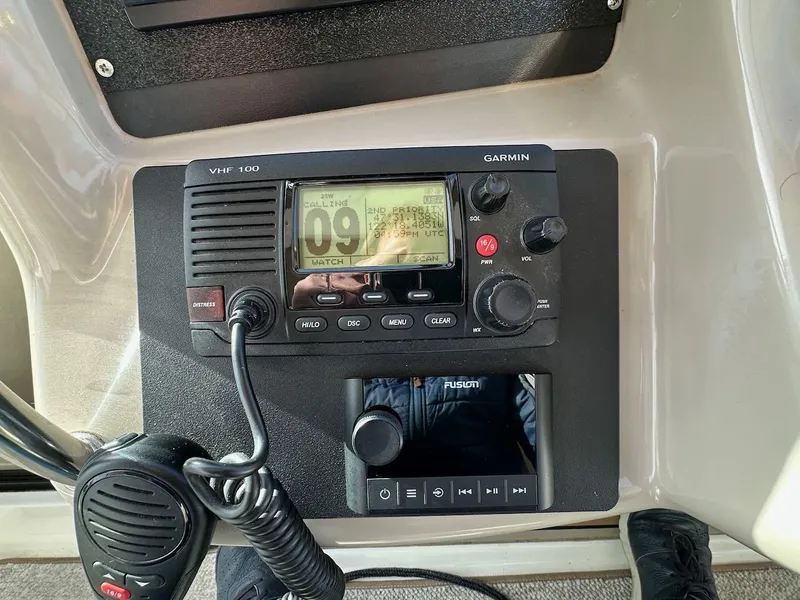 Slide: The Image of Garmin VHF 100 radio and Fusion audio system on 2004 Sea Ray 340 Sundancer. - 34