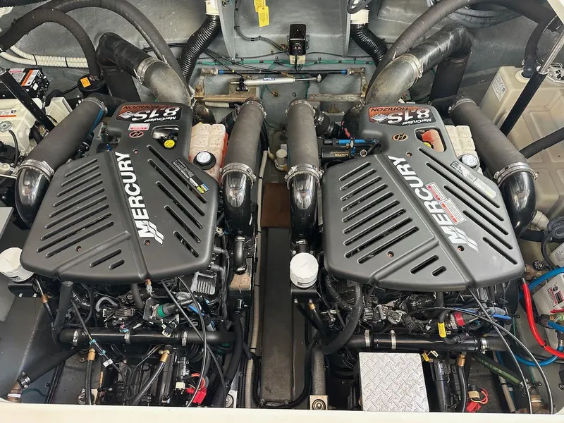 Slide: The Image of Twin Mercury engines in a 2004 Sea Ray 340 Sundancer boat. - 48