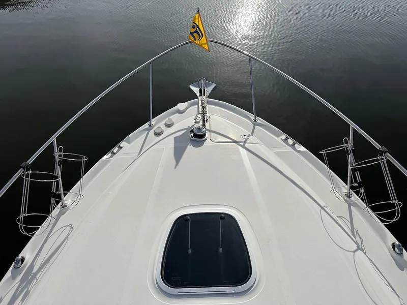 Slide: The Image of Bow view of 2004 Sea Ray 340 Sundancer on calm water. - 5