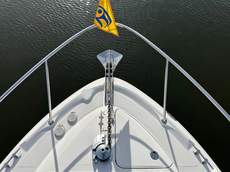 Slide: The Image of Bow of 2004 Sea Ray 340 Sundancer with anchor and yellow flag. - 6