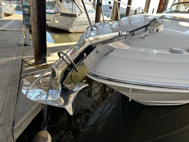 Slide: The Image of 2004 Sea Ray 340 Sundancer boat with polished anchor at dock. - 7