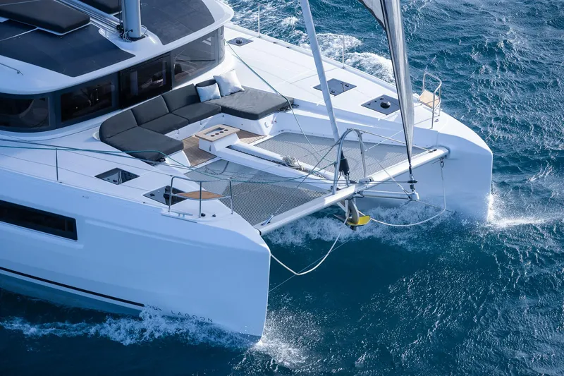 Slide: The Image of 2025 Lagoon 51 ICONIC catamaran sailing on blue ocean waters. - 20
