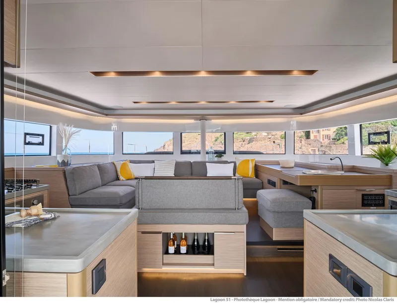Slide: The Image of Luxurious interior of 2025 Lagoon 51 ICONIC yacht with modern furnishings and panoramic windows. - 29