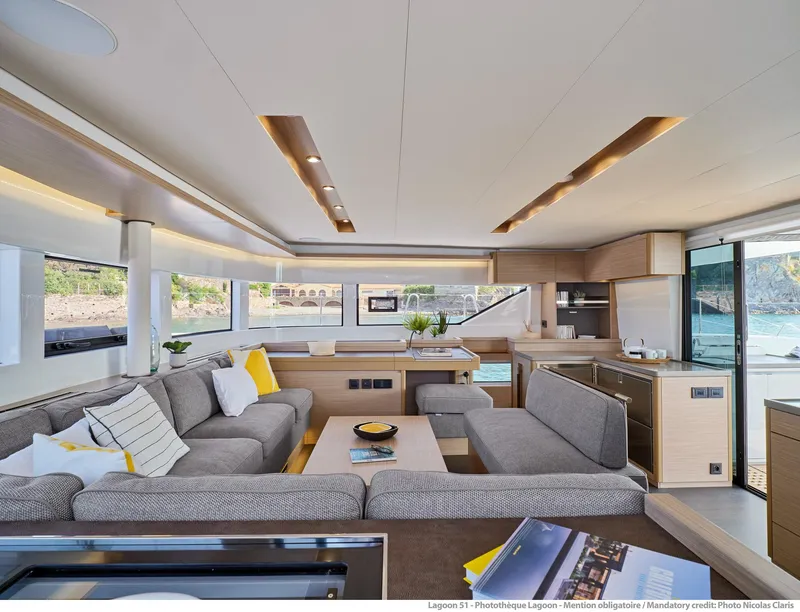 Slide: The Image of Luxurious interior of 2025 Lagoon 51 ICONIC yacht with modern furnishings and panoramic windows. - 32