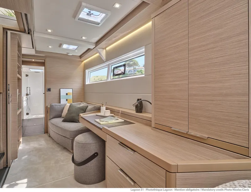 Slide: The Image of Luxurious interior of 2025 Lagoon 51 ICONIC yacht with modern furnishings and natural light. - 48