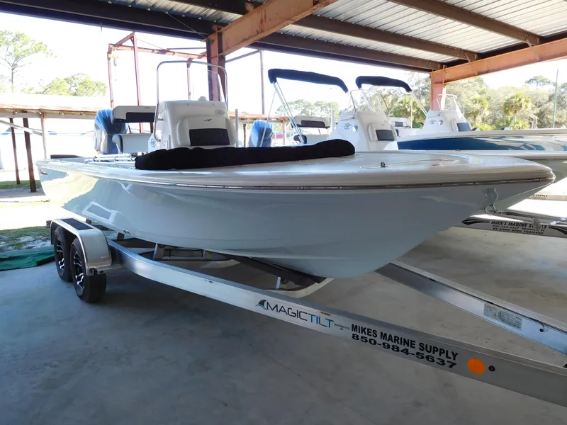The Image of 2025 Tidewater 2110 Bay Max boat on trailer in covered storage area. - 1