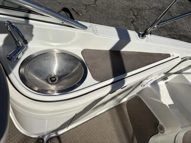 Slide: The Image of Engine compartment of a 2011 Sea Ray 260 Sundeck boat, showing mechanical components. - 12