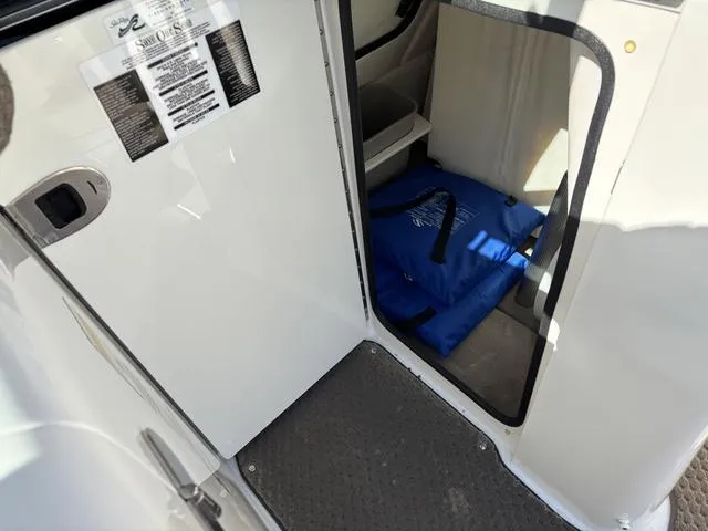 Slide: The Image of Interior view of a 2011 Sea Ray 260 Sundeck boat with storage compartment. - 16