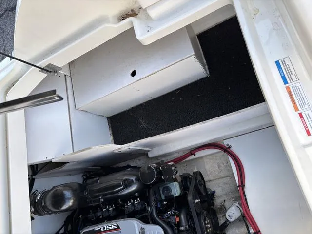 Slide: The Image of Engine compartment of a 2011 Sea Ray 260 Sundeck boat, showing mechanical components. - 20