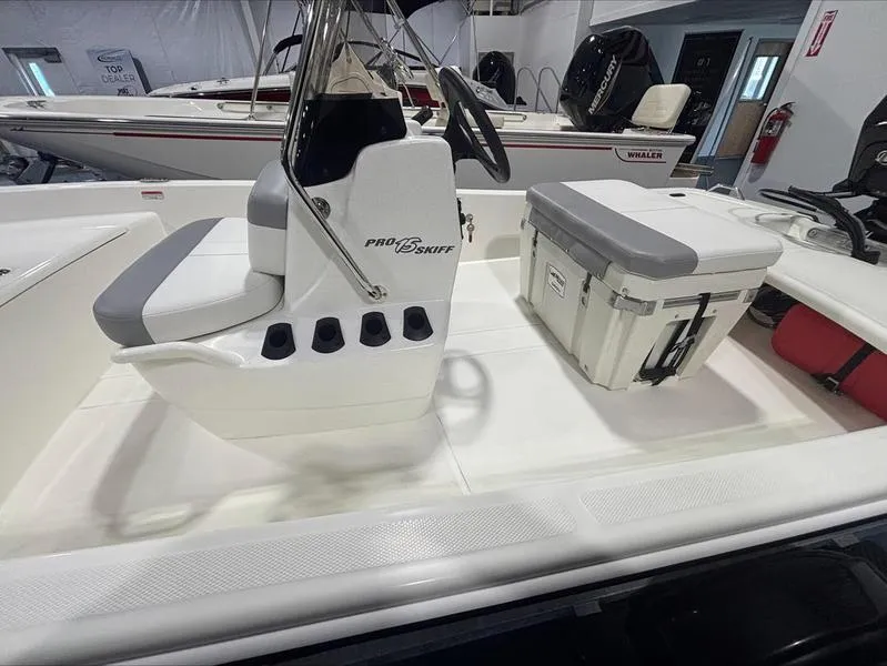 Slide: The Image of 2025 Mako Skiff 15 CC boat interior with seating and storage. - 10