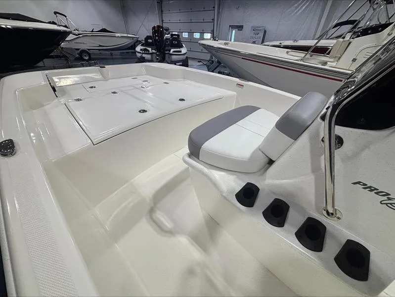 Slide: The Image of 2025 Mako Skiff 15 CC boat interior with seating and storage compartments. - 3