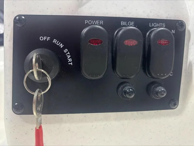 Slide: The Image of Control panel of 2025 Mako Skiff 15 CC with ignition and switches. - 6