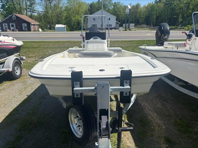 Slide: The Image of 2025 Mako SKIFF 13 CC boat on trailer, parked outdoors. - 3