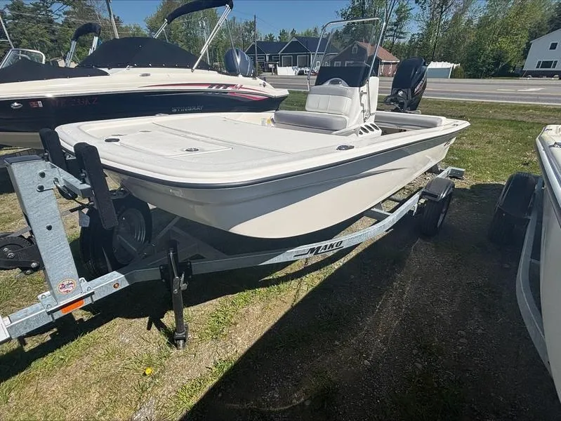 Slide: The Image of 2025 Mako SKIFF 13 CC boat on trailer, parked outdoors. - 6