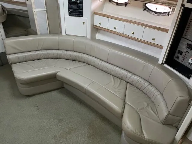 Slide: The Image of Luxurious beige leather seating in a 1998 Maxum 4100 SCR yacht interior. - 6
