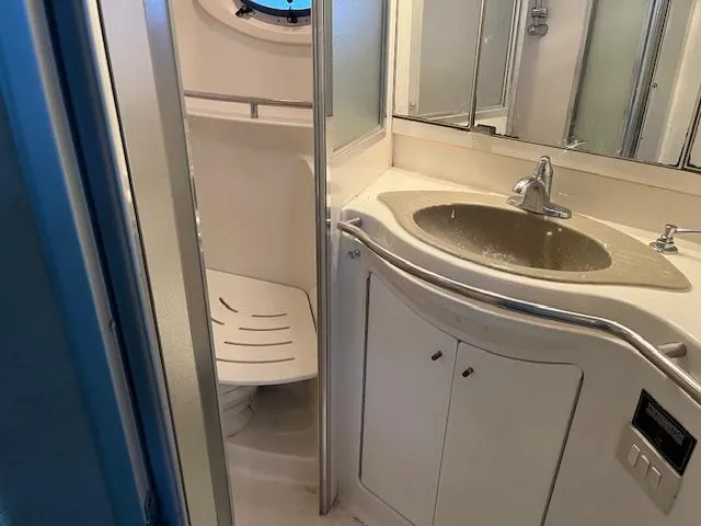 Slide: The Image of Bathroom interior of 1998 Maxum 4100 SCR yacht with sink and shower. - 7